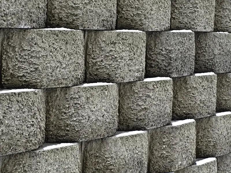 How to Match Existing Bluestone Patios and Fieldstone Foundations to a New Retaining Wall